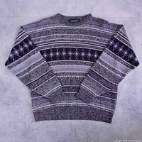 Full front view of Caldwell sweater showing overall pattern and colors