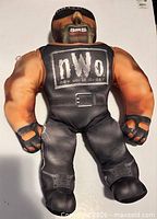 Front view of Hollywood Hogan plush electronic figure showing nWo logo and overall condition