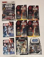 Front of nine sealed Star Wars figure packages