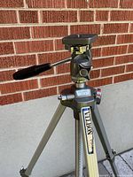 Tripod standing, showing pan-tilt head, handle and Velbon VG-3 branding