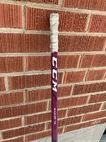 Upper shaft with CCM logo and taped knob