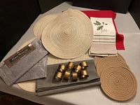 Full lot overview with placemats, runner, napkin rings, hot pads, tea towel