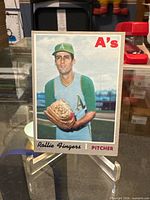 Front view of Topps #502 Rollie Fingers card on stand