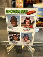 Front of 1977 Topps #476 Rookie Catchers card showing four player images and names