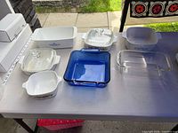 Overview of all eight bakeware pieces on table