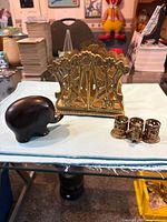 Group shot showing letter holder, napkin ring set, and wooden elephant