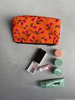 Full lot: pouch, scrub cream tube, two green-lid jars, peach-lid jar, lip sample tube, eyeshadow compact