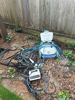 Pool cleaner with power unit and cable on ground
