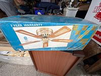 Front of box showing image of Dynasty ceiling fan and 7-year warranty text
