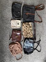 All seven handbags laid out