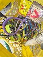 Overview of crate showing bungee cords, packaged Victor rat trap
