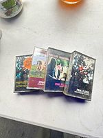 Four Pink Floyd cassette cases laid out showing cover art