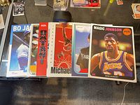All six magazine covers fanned out on table
