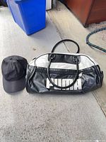 Puma duffel bag front view with black cap