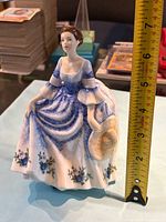 Front view showing full figurine and tape for scale