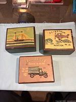 All three wooden boxes top view showing graphics
