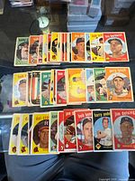 Overall lot layout showing three staggered rows of vintage Topps baseball cards