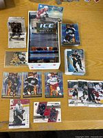Box and stacks of Upper Deck hockey cards with several featured cards laid out