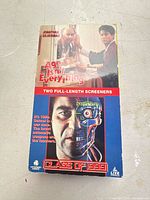 Front of VHS slipcase showing titles and artwork