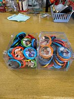 Two clear boxes filled with colourful MLB player pinback buttons