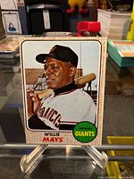 Full front view of Willie Mays Topps card on display stand