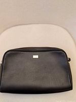 Front view of Corneliani leather toiletry bag