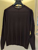 Front view of sweater on hanger