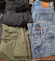 Four folded pants showing colors and styles