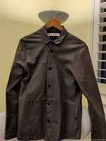 Front view of Marni brown leather-suede jacket on hanger