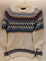 Front view of Roberto Collina Fair Isle sweater on hanger