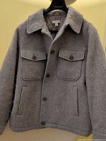 Front view of light gray wool-blend Topshop shacket on hanger