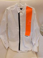 Full view of DSQUARED2 shirt front showing orange and black stripes