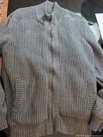Full view gray zip-front sweater