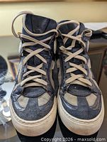 Top view of both sneakers showing lacing, toe caps and material mix