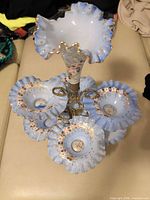 full view of epergne showing central trumpet and surrounding bowls