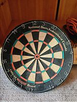 Full view of dartboard showing brand and federation endorsement