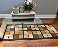 Overview of rug, boot trays, shoe rack bench and planters