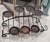 Close view of wrought iron 7-arm candelabra