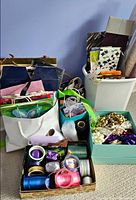 Overview of assorted gift bags, ribbons, bows and wrapping supplies