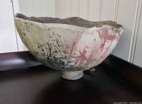 side view of handmade bowl showing exterior texture and foot
