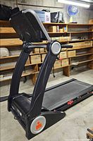 Full side view of folded Ironman Quest treadmill