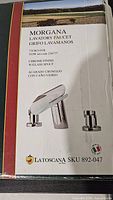 Box label showing Morgana lavatory faucet details, chrome finish with glass spout, SKU 892-047, Italian flag for made in Italy