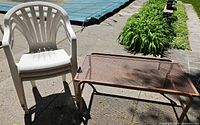 full view of table and stacked chairs outdoors