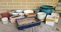Group shot showing all planters against brick wall