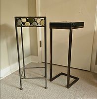Both metal plant stands side by side showing overall design and height comparison