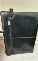 Black leather Mancini portfolio front view