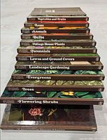 Stack of 12 hardcover gardening books showing spines and titles