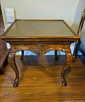 Front view showing overall design, wood frame, brass top