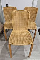 Front view of three wicker chairs