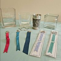 Group shot showing goblet, bookmarks, maple leaf, three glass vases